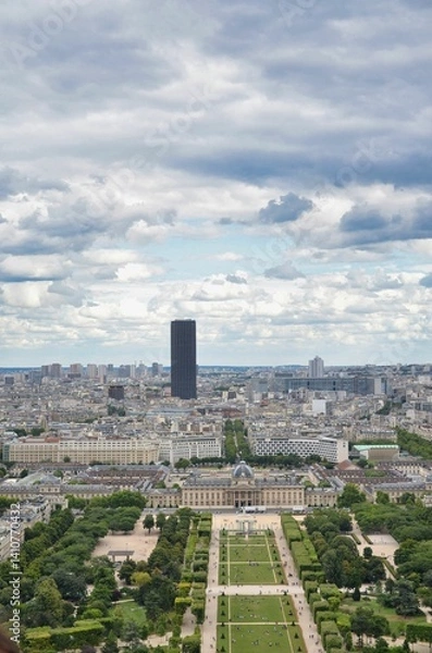 Fototapeta The Champ de Mars is a public garden in Paris located on the Left Bank. It is bordered to the northwest by the Eiffel Tower and to the southeast by the École Militaire.