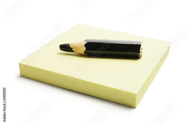 Fototapeta Black Pencil on Post It Note Pad