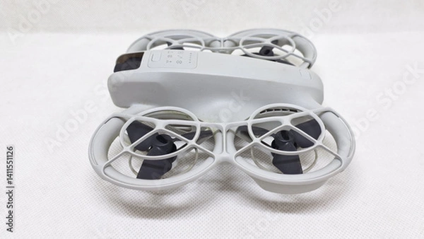 Fototapeta Unmanned aerial vehicle controlled remotely drone used for various purposes such as aerial photography military recreational mapping surveillance delivery due to their ability to reach difficult areas