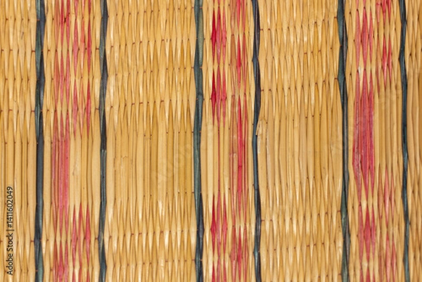Fototapeta Colorful bamboo mat texture shows a natural brown and yellow striped pattern