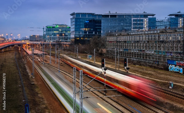 Fototapeta Commuter Trains in an Office District
