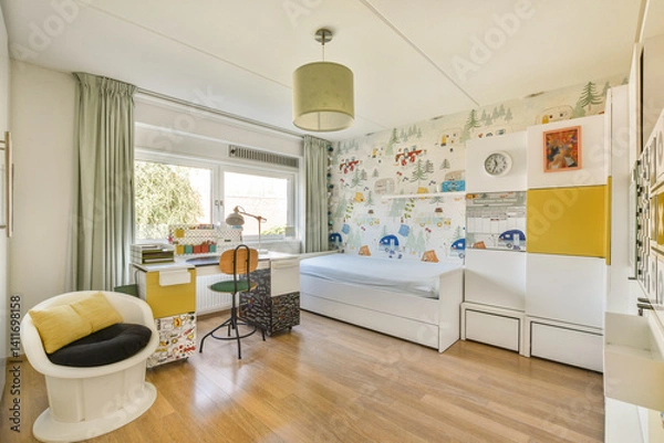 Obraz A stylish and spacious bedroom featuring a cozy bed, colorful wallpaper, and modern furniture, perfect for relaxation and productivity.