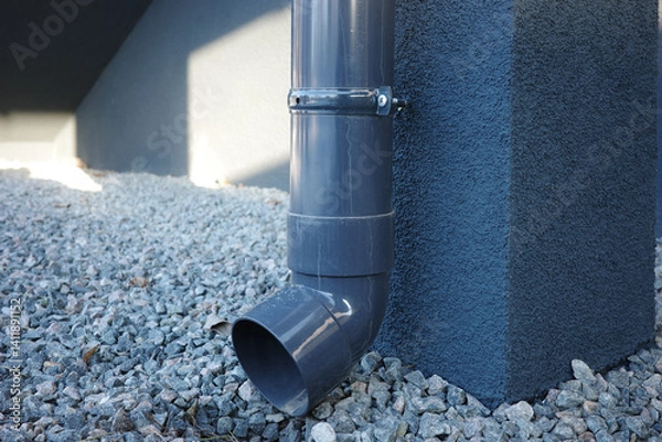 Fototapeta Plastic gutter and drainage system for water from melted snow and rain.