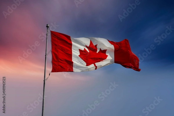 Fototapeta Canadian flag fluttering in the wind against moody sky