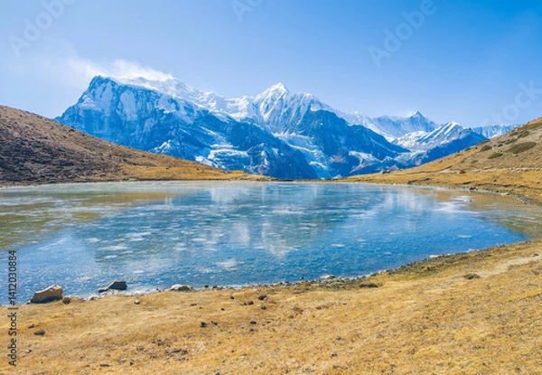 Fototapeta Himalayas, Nepal - The famous hiking on the roof of the world called Annapurna Circuit in the Himalaya range mountain, with little village, buddhist stupa and mountains of 8000 meters.