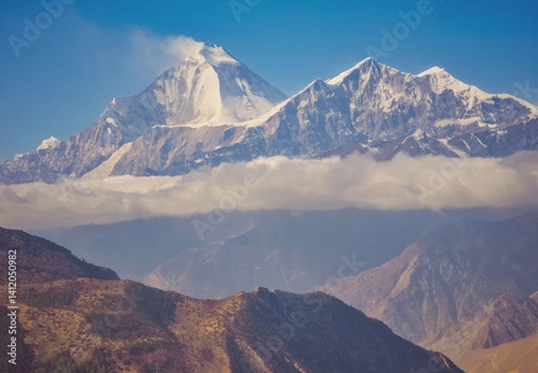 Fototapeta Himalayas, Nepal - The famous hiking on the roof of the world called Annapurna Circuit in the Himalaya range mountain, with little village, buddhist stupa and mountains of 8000 meters.