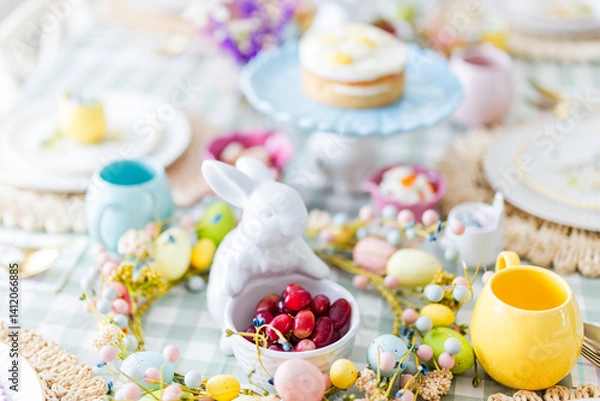 Obraz Easter table with bunny statue holding strawberries