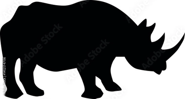 Fototapeta Black silhouette of a rhinoceros, great for wildlife concepts, safari logos, and nature-themed designs. Vector EPS with bold and solid shape
