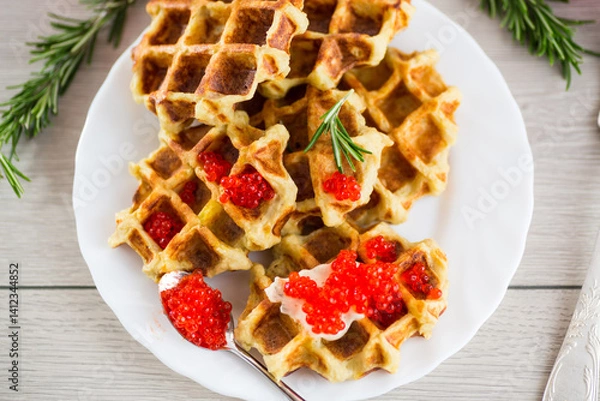 Obraz Crispy potato waffles with caviar in a beautiful presentation