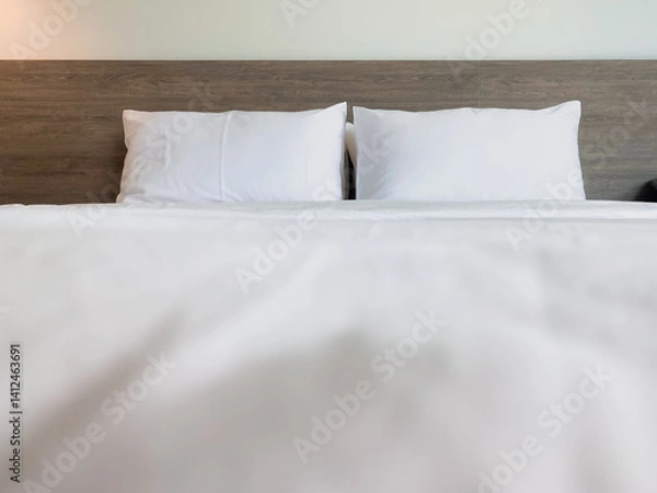 Fototapeta Minimalist Bedroom Design with Soft White Bedding and Pillows