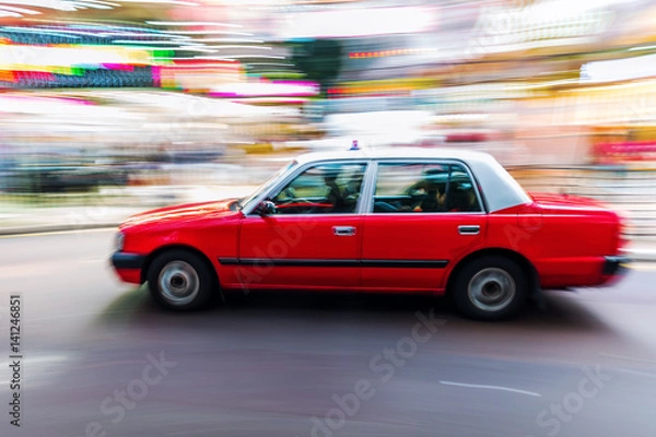 Fototapeta Hongkong taxi on the road in motion blur