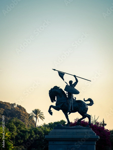 Fototapeta Silhouette of a statue of a victorious knight on a horse