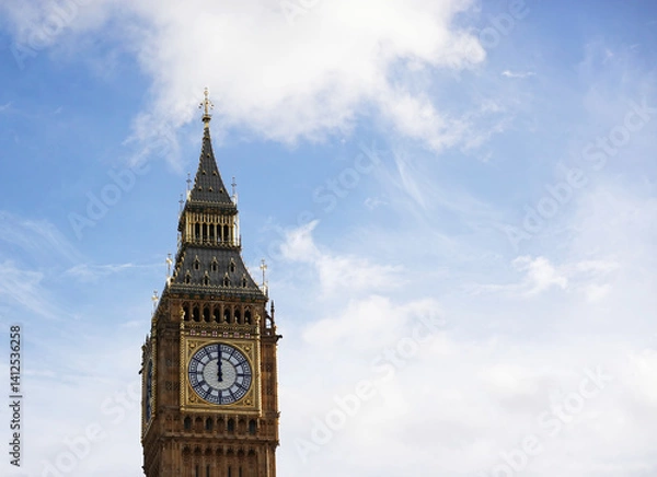 Fototapeta A view of the historic clocktower known as Big Ben and the Elizabeth Tower,  with the clock hands on 12 o'clock noon, Westminster, London. 