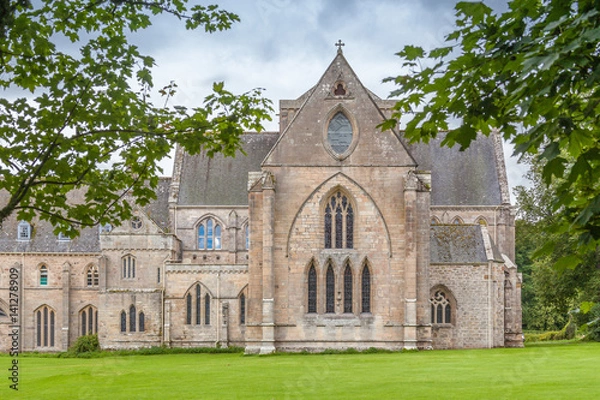 Fototapeta Pluscarden Abbey in Scotland with green grass and trees