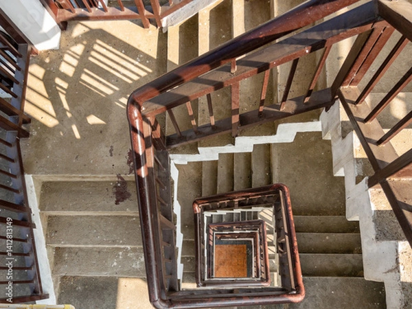 Fototapeta Top-Down View of a Spiral Staircase Inside a Bird-Watching Tower.