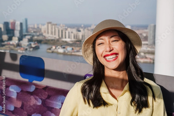 Obraz Happy tourist enjoying the view from ferris wheel cabin