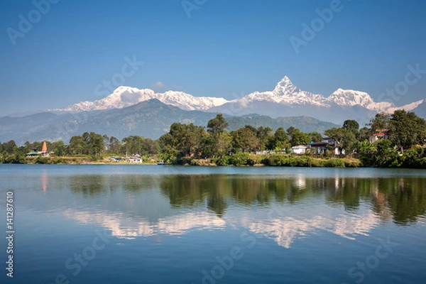 Fototapeta View at Annapurna mountain range and its reflection in Phewa lake in Pokhara, Nepal
