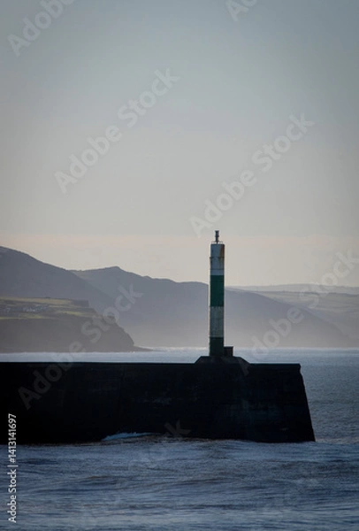 Obraz the light at aberystwyth harbour on a misty sunny morning