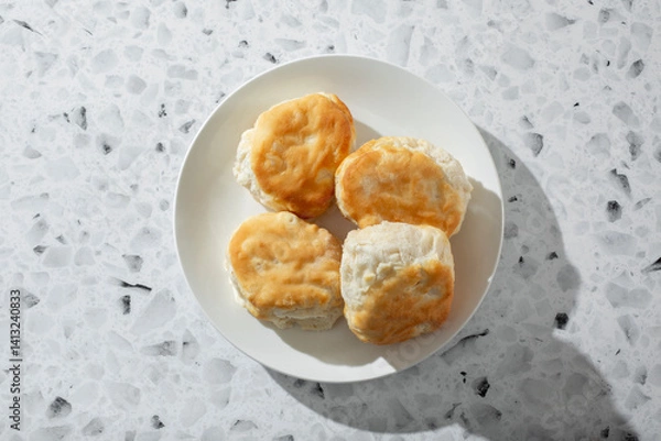 Fototapeta A top down view of a plate of biscuits.