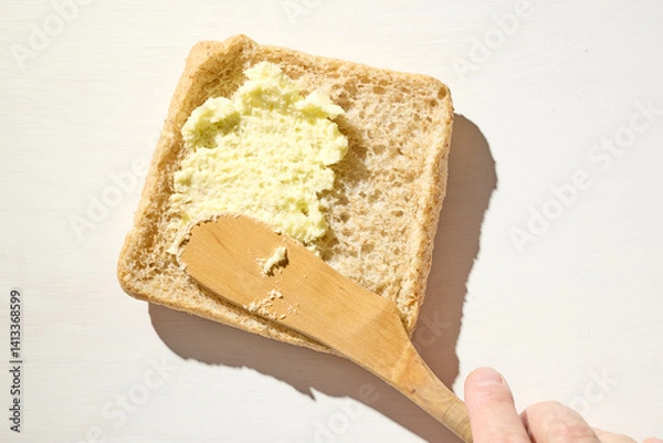 Obraz bread slice with whipped butter smear