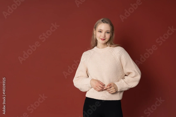 Obraz Portrait of young attractive blonde asian woman on red background copy space