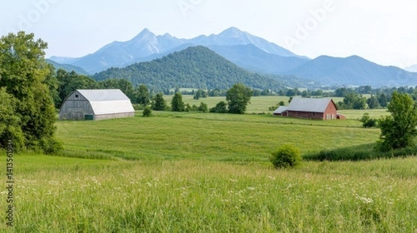Fototapeta Serene landscape rolling green field with distant mountains