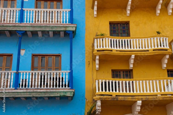 Fototapeta Blue and Yellow Columbian Building Exteriors