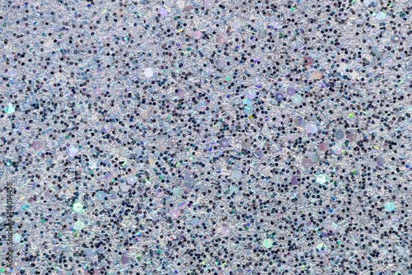 Fototapeta Full frame macro abstract texture background of sparkling multicolor glitter surface in shades of blue, white, black and lavender