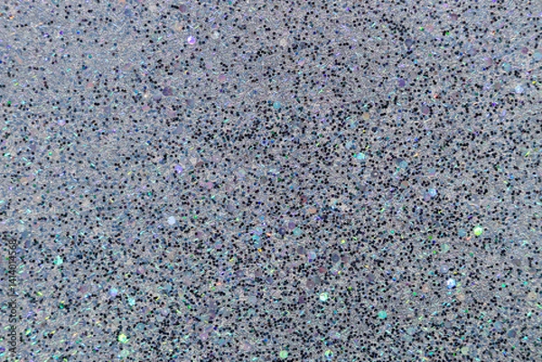Fototapeta Full frame macro abstract texture background of sparkling multicolor glitter surface in shades of blue, white, black and lavender