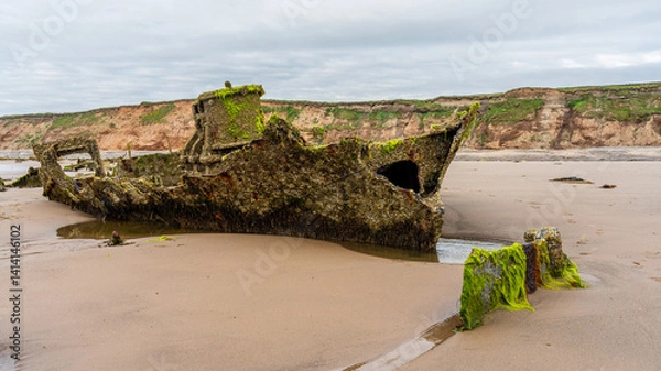 Fototapeta Stones on the beach and the ST Pasages Shipwreck between Ballasalla and Sartfield, Isle of Man