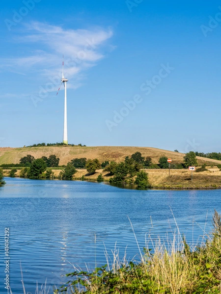 Fototapeta A wind turbine on the Grosse Ruhrinsel, Muelheim an der Ruhr, Ruhr Area, North-Rhine Westphalia, Germany