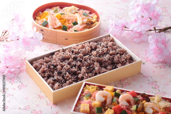 Fototapeta 日本でお祝いの行事の時に食べるピンクの背景で桜を入れて撮影したお赤飯