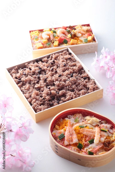 Fototapeta 日本でお祝いの行事の時に食べるピンクの背景で桜を入れて撮影したお赤飯
