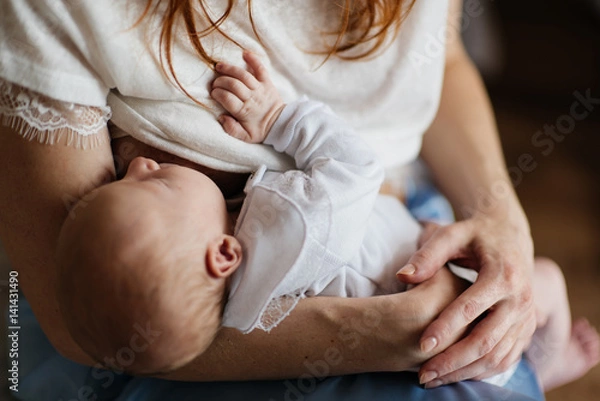 Obraz Newborn baby being breastfed by mother