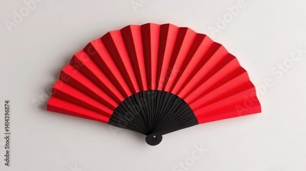 Obraz A vibrant red and black folding fan, elegantly spread open, showcasing its intricate pleats against a neutral background.