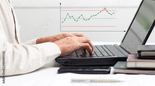 Fototapeta Process engineer work with laptop with analyze graph data out of control at workplace in office, process development and improvement concept