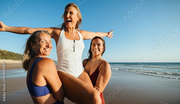 Obraz Friends having fun on the beach under a clear blue sky
