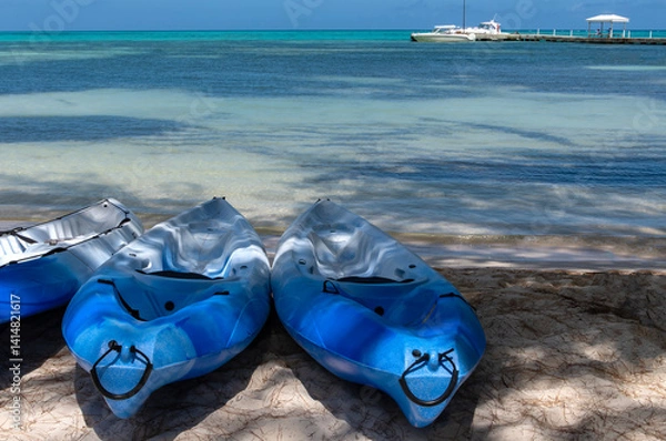 Obraz Row of Blue Kayaks on a Sandy Beach in Rum Point, Grand Cayman Island