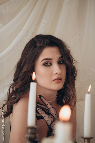 Fototapeta Elegant woman with candlelight in romantic vintage setting