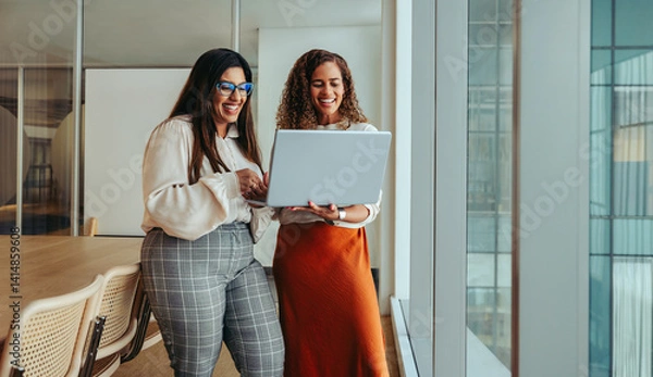 Obraz Young professionals collaborating in a modern tech startup office space