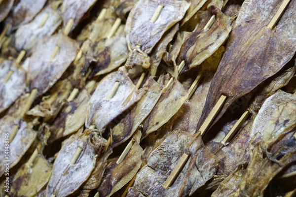 Fototapeta dry squid in row.Traditional squids drying in Grilled squid in Thailand market