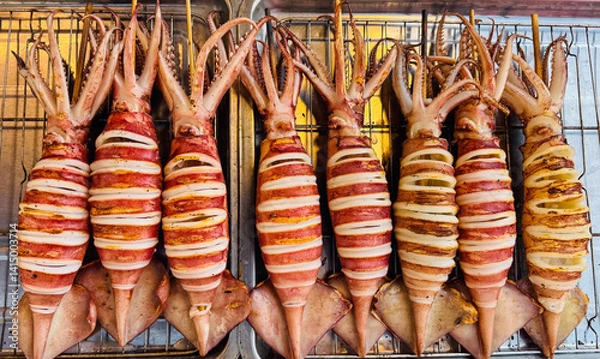 Obraz Grilled squids with scored bodies