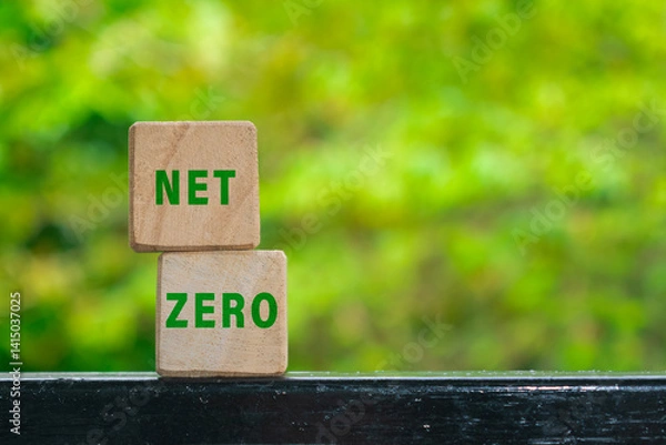 Obraz net zero words text on wooden blocks isolated on green nature background. carbon neutral net zero emissions concept