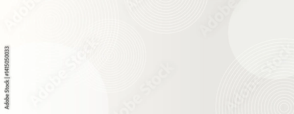 Fototapeta A light gray background with a subtle gradient. The background features circular patterns, adding texture to the gray color scheme. Circle pattern background vector. White background.