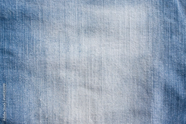 Obraz Background denim texture. Close-up of worn and washed blue denim fabric texture