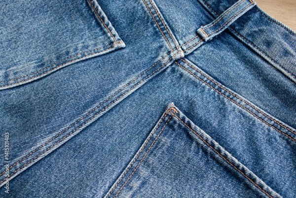 Obraz Close-up of blue denim jeans with pockets and stitch details. Background denim texture