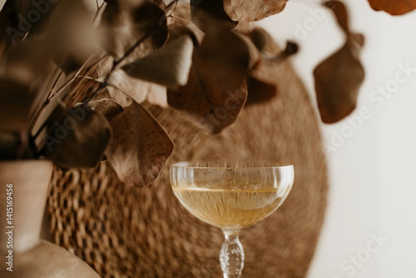 Obraz Close-Up of Champagne Glass and Eucalyptus in a Cozy Neutral Setting