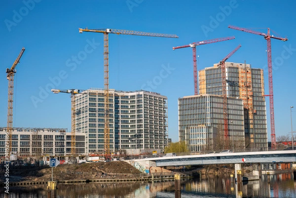 Obraz Office building construction site with cranes seen in Berlin, Germany