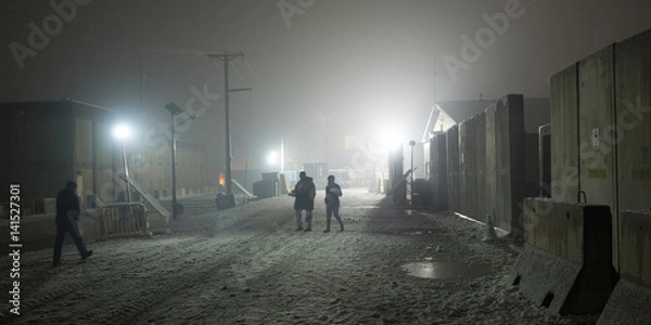 Obraz Nightly walk to chow hall on Afghanistan military installation during snow