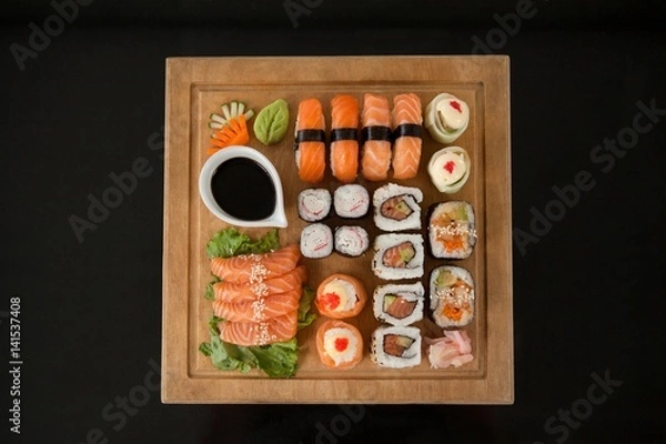 Fototapeta Assorted sushi set served on wooden tray